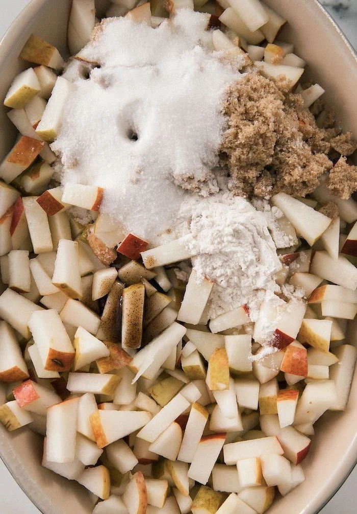 chopped apples, flour and sugar, cinnamon powder, in white casserole, easy thanksgiving desserts