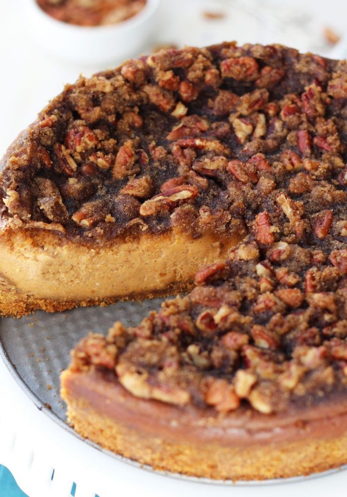pecan cheesecake, thanksgiving dessert recipes, silver cake pan, walnuts on top, white table