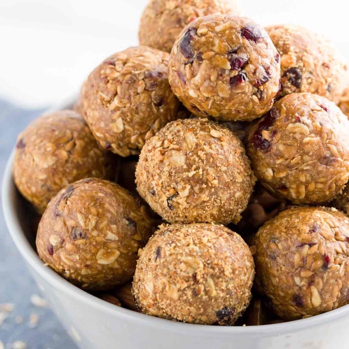 peanut butter, oatmeal and dates, no bake protein balls, in white bowl