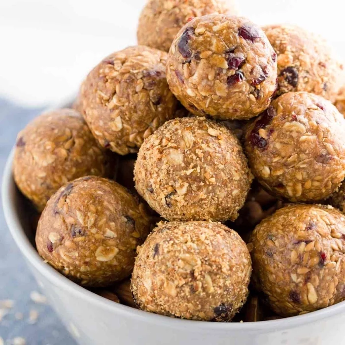 peanut butter, oatmeal and dates, no bake protein balls, in white bowl