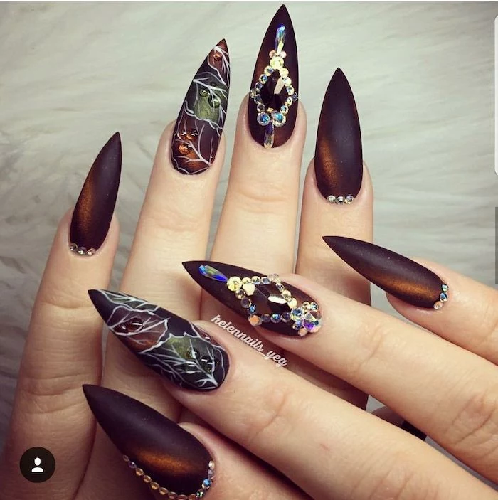long stiletto nails, 2019 nail trends, dark orange, red nail polish, ombre nails, rhinestones and leaves, nail decorations