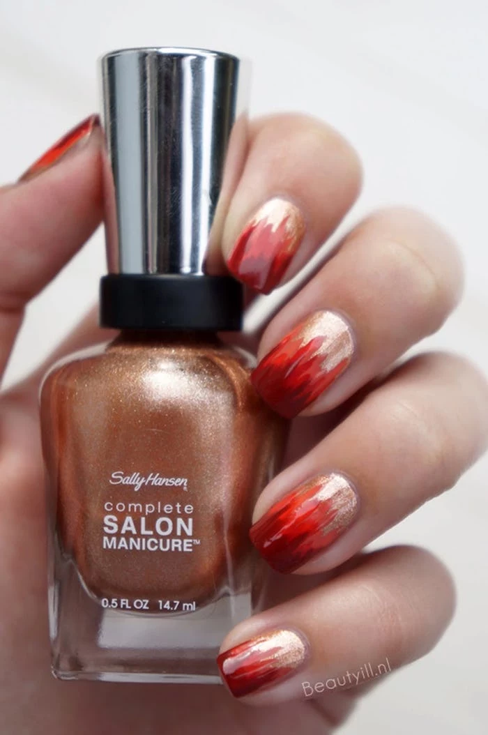 gold glitter, nail polish bottle, red and orange flames, nail decorations, autumn nails, white background