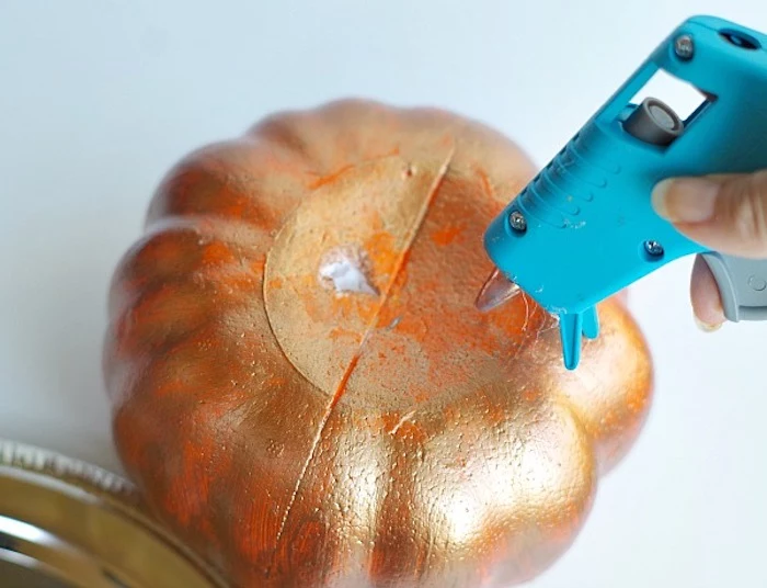 pumpkin painted in gold, thanksgiving decorations diy, glue gun, step by step, diy tutorial
