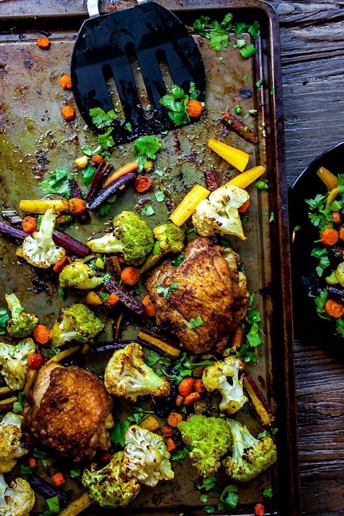 chicken with vegetables, cauliflower and broccoli, carrots and cabbage, sheet pan, wooden table, weight loss meal plan