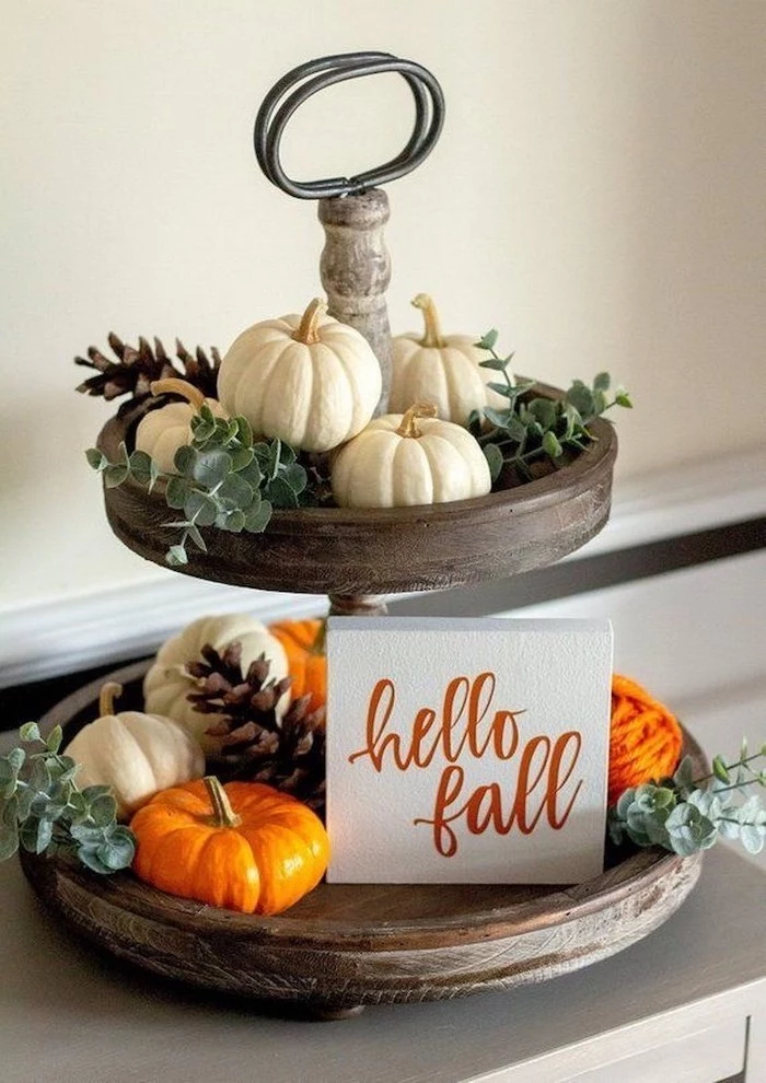 hello fall, wooden cake stand, small pumpkins, pine cones, arranged on it, outdoor thanksgiving decorations