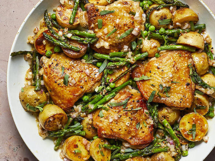 honey garlic chicken, with asparagus ad potatoes, in white plate, easy dinner recipes for beginners, white table
