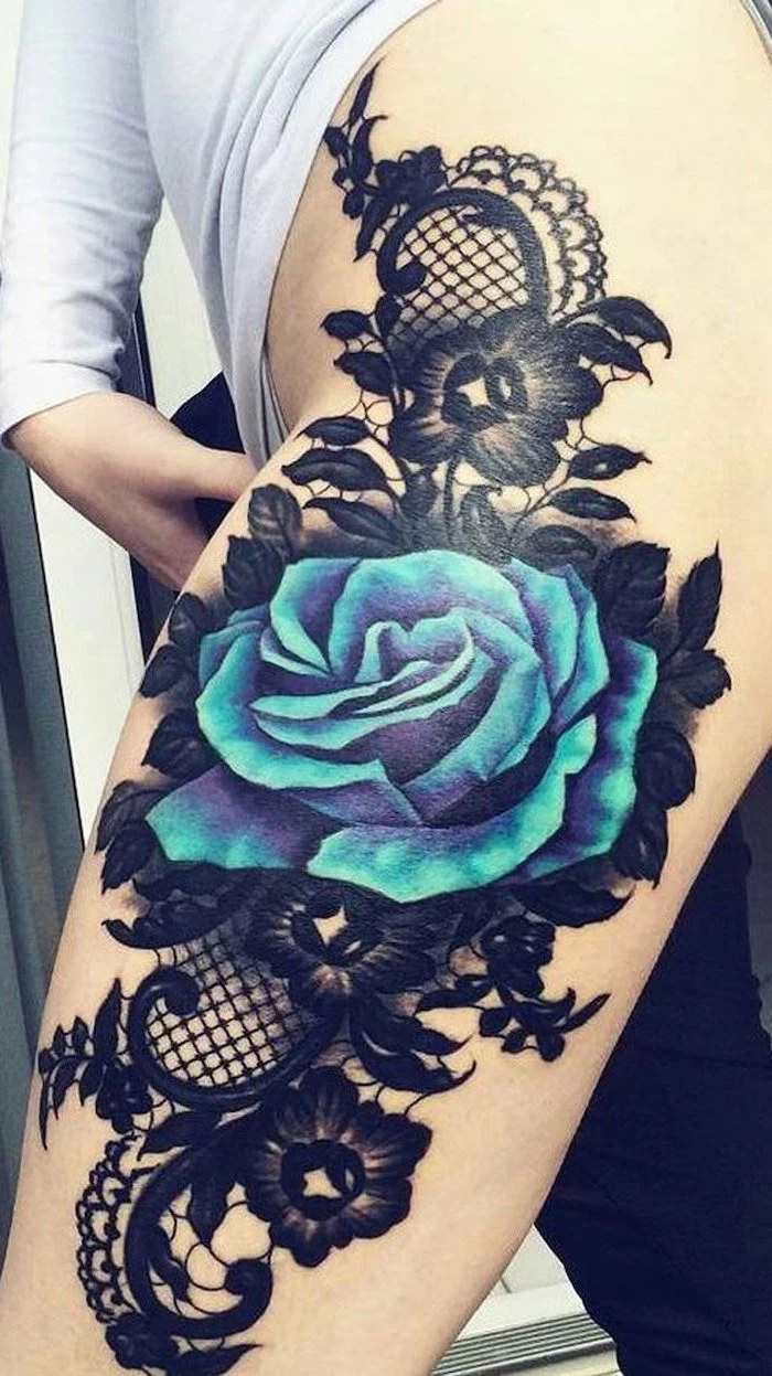 large blue rose, black flowers, black lace, white blouse, black pants, thigh tattoo ideas