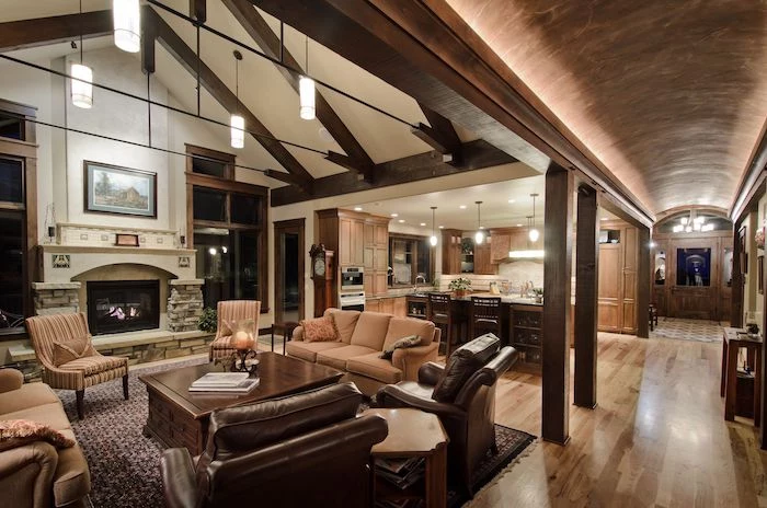 what is a vaulted ceiling, barrel ceiling, in the hallway, brown leather armchairs, beige sofas, wooden table