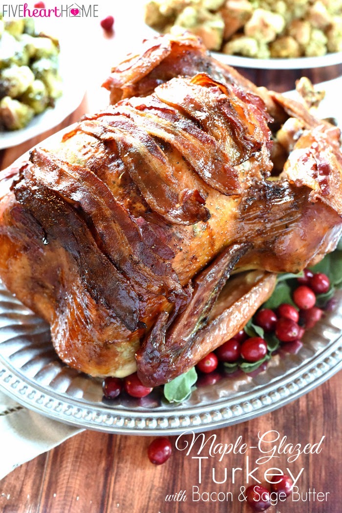roasted turkey, covered in bacon, how to cook a turkey, cranberries and fresh herbs, in a silver tray