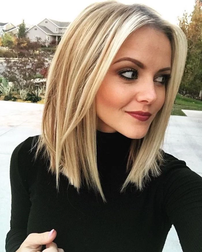 woman with blonde hair, wearing black polo blouse, medium length haircuts for women