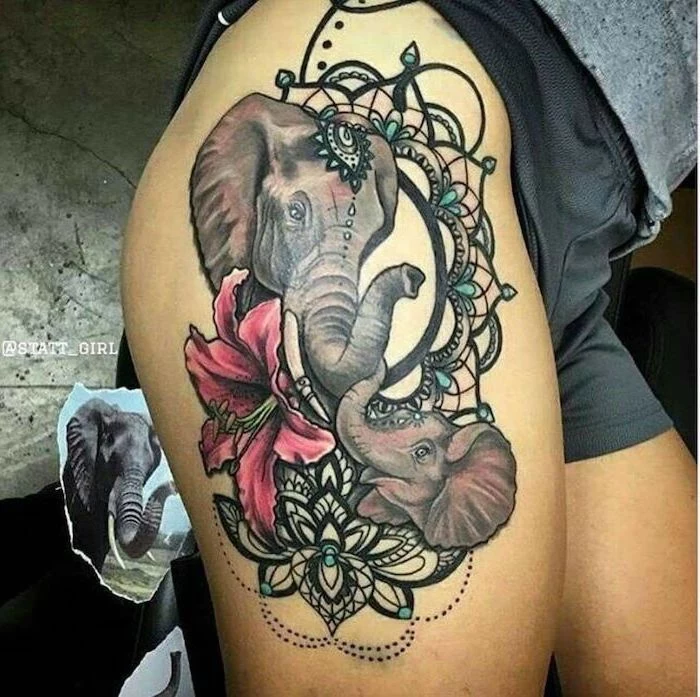 mother and baby elephants, mandala flower tattoo, pink orchid, leg tattoo ideas, black shorts, grey blouse