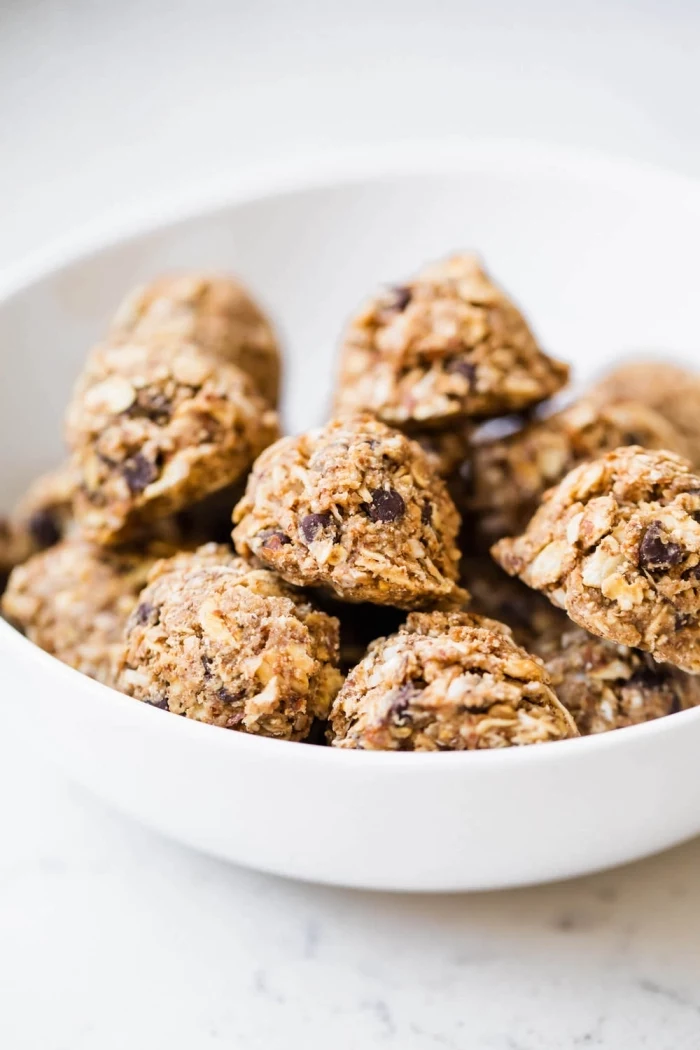 oatmeal bites, with chocolate chips, in a white bowl, protein ball recipe
