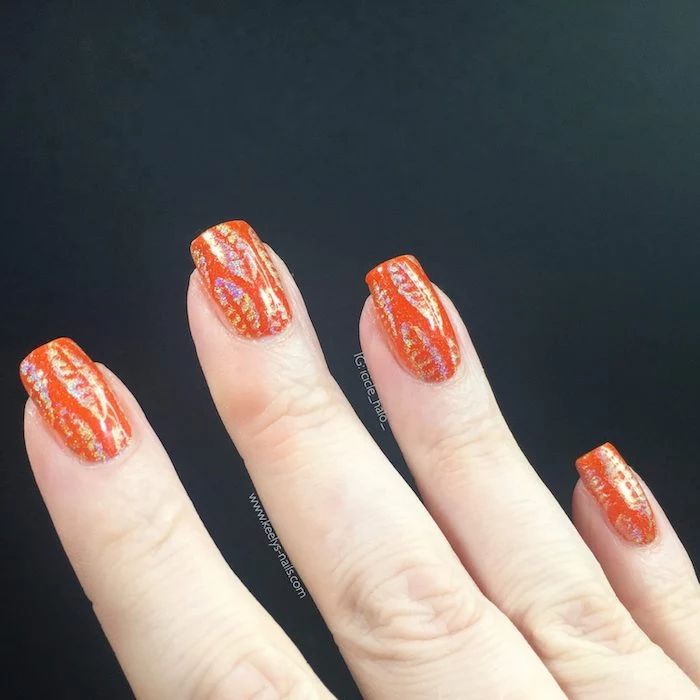 orange nail polish, gold glitter, fall leaves, nail decorations, square nails, black background, light nail colors