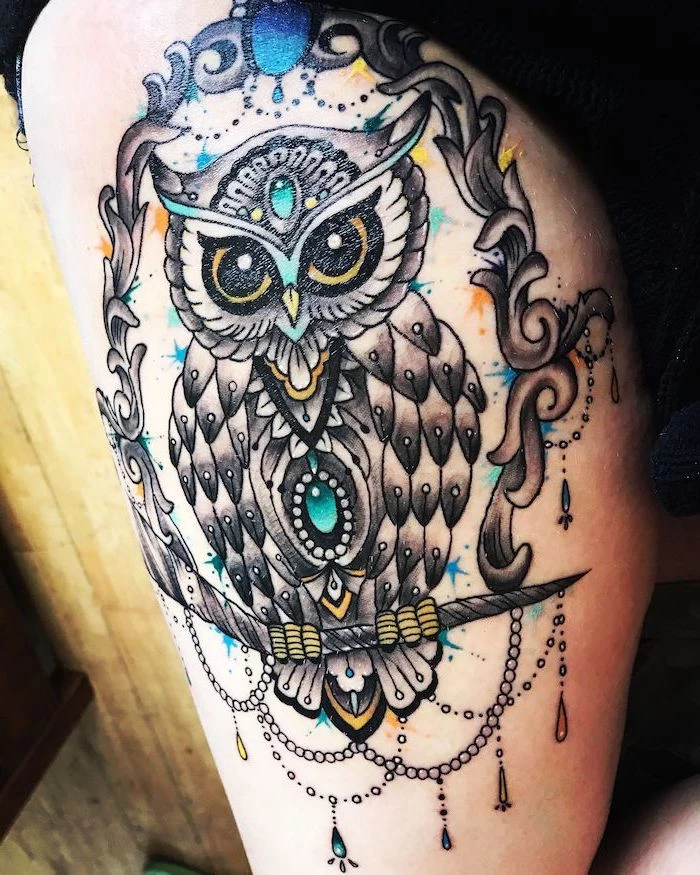 colored tattoo, large owl, leg tattoo ideas, inside a frame, wooden floor
