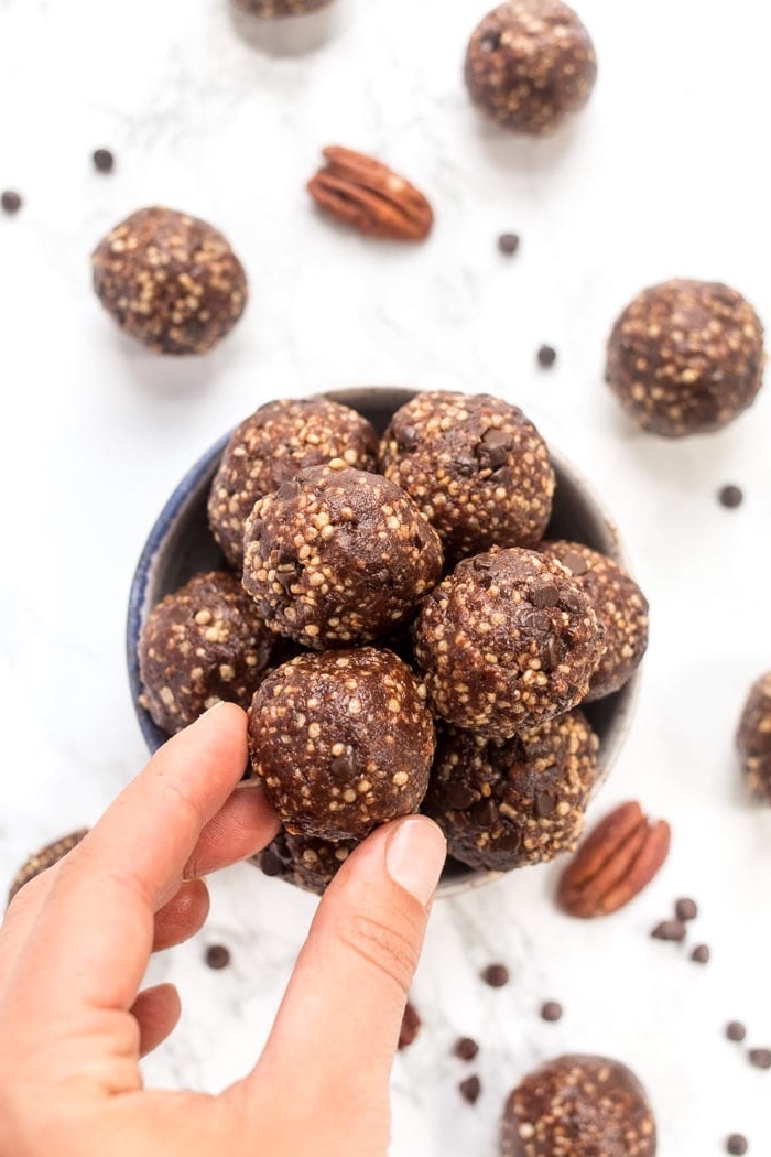 chocolate truffles, in a bowl, protein ball recipe, chocolate chips, walnuts scattered around the table