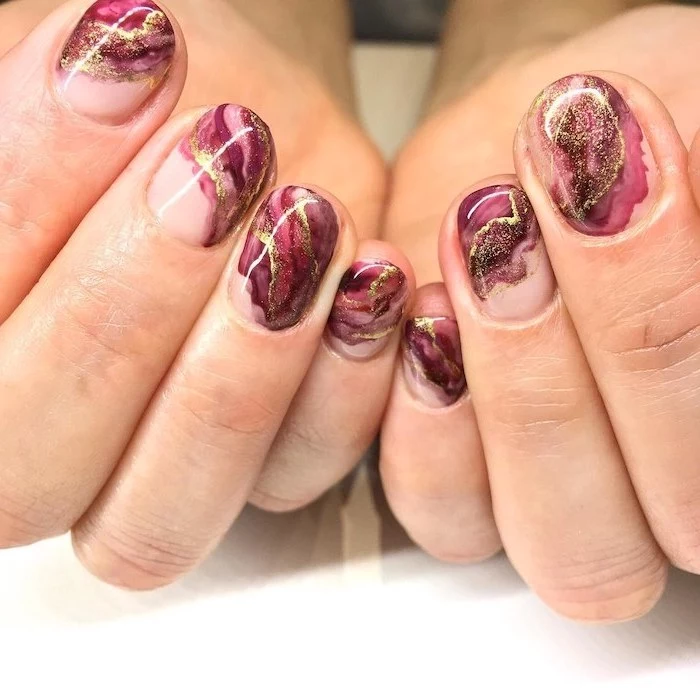 purple and pink, gold glitter, marble nails, neutral nail colors, short squoval nails, white table