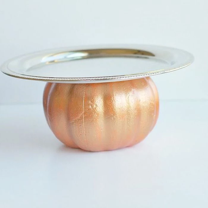 white background, thanksgiving decorations diy, pumpkin painted in gold, silver tray attached to it