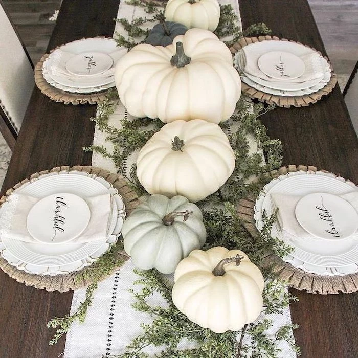 pumpkins arranged as table runner, thanksgiving door decor, white table runner, wooden table