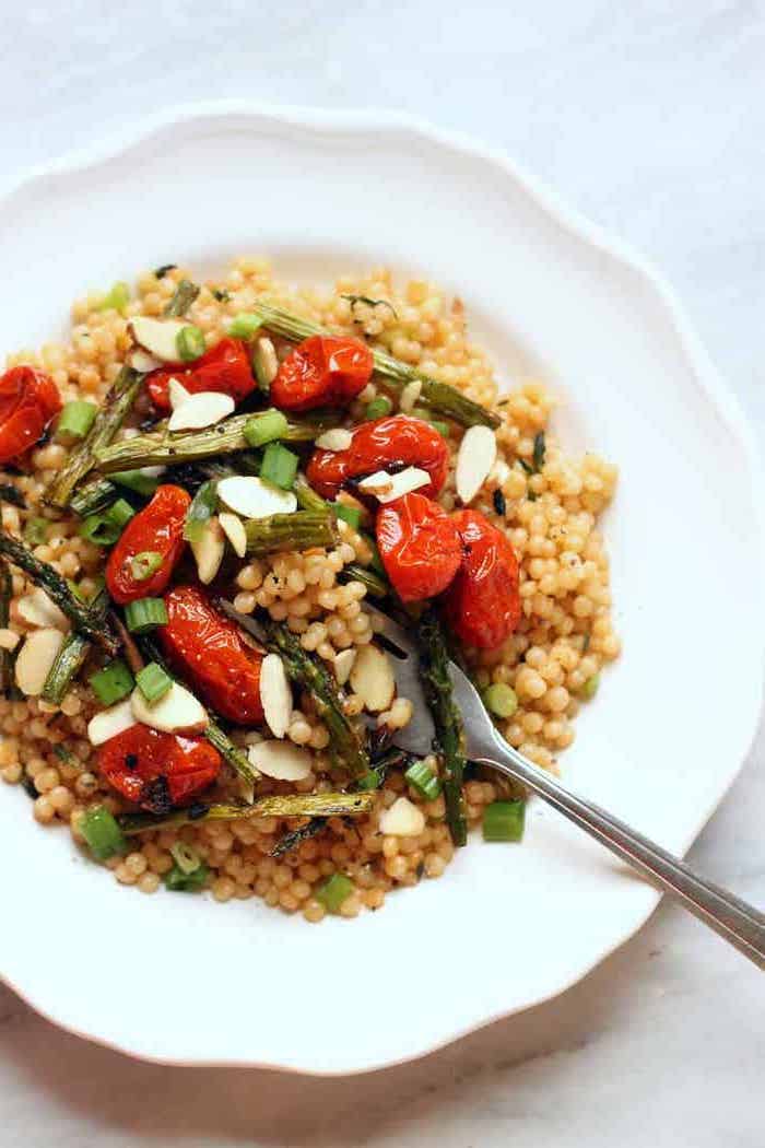 healthy meal prep ideas for weight loss, quinoa with baked asparagus, cherry tomatoes, white plate