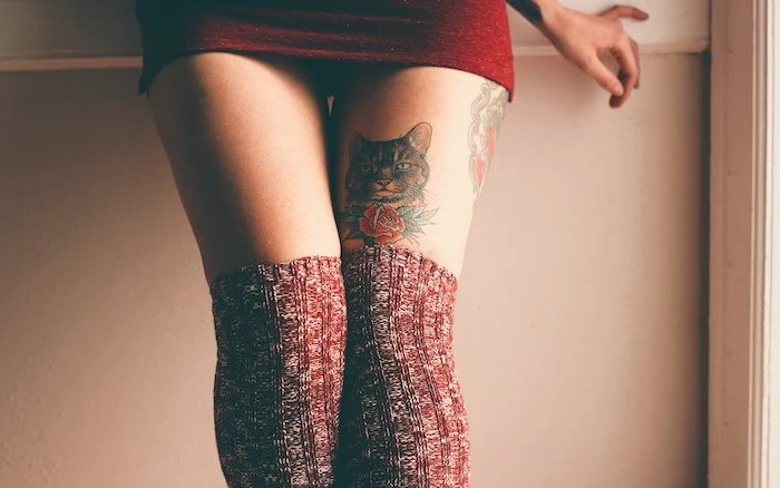red dress, red knitted socks, leg tattoos for girls, cat portrait, red rose