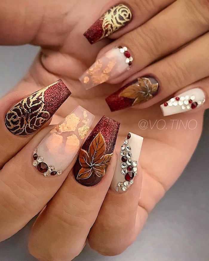 dark red glitter, nude nail polish, gold glitter, rhinestones on nails, nail decorations, burnt orange nails, coffin nails