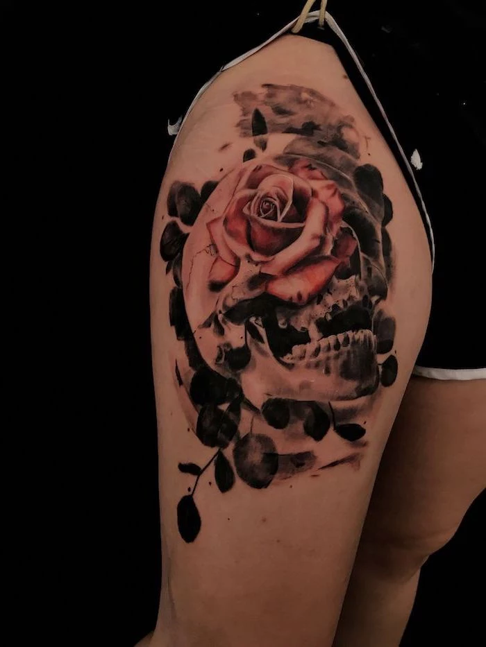 human skull, red rose, leg tattoos for girls, black shorts, black background