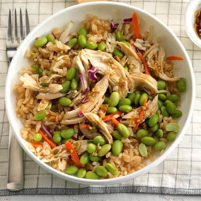 beans and rice, chicken meat, cabbage and carrots, healthy meal prep ideas for weight loss, stir fry, in white bowl