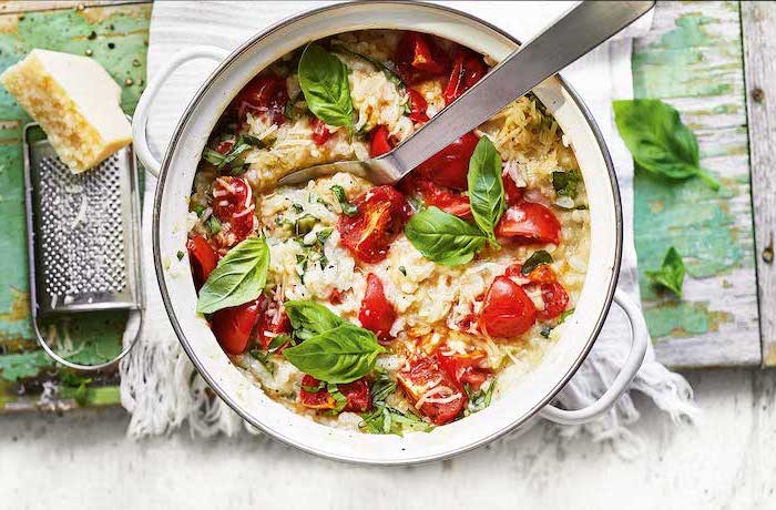 roasted tomato risotto, with basil garnish, healthy meal prep ideas for weight loss, grated parmesan, white cloth