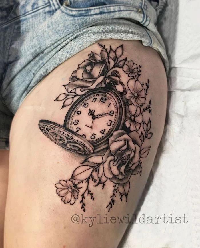 denim shorts, pocket watch, surrounded by flowers, side thigh tattoo, white bed linen