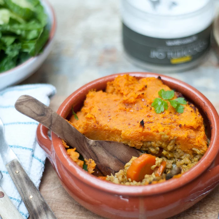 shepherd pie, in a ceramic bowl, pumpkin squash on top, simple meal plan to lose weight, rice inside, wooden spoon