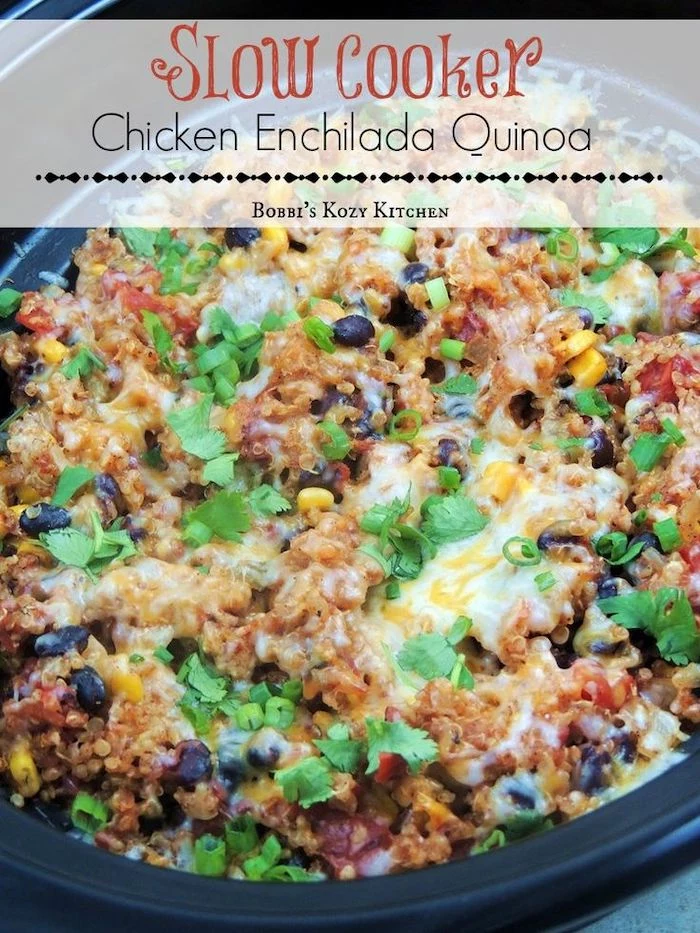 chicken enchilada quinoa, with black beans, cooked in black skillet, easy weeknight dinners, parsley for garnish