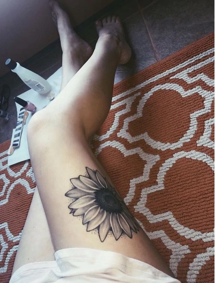 orange carpet, nail polish, sunflower tattoo, upper thigh tattoo, tiled floor