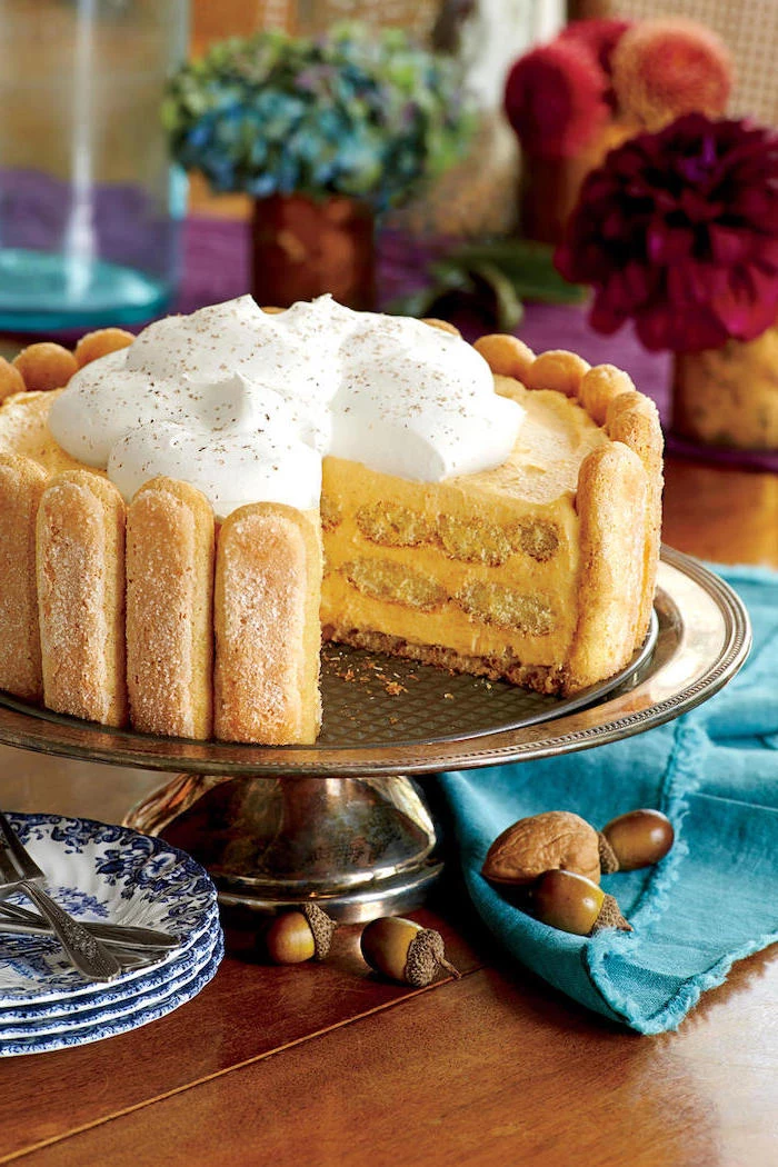 best thanksgiving pies, cake stand, cake with biscotti, cream on top, blue cloth, wooden table