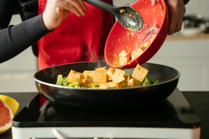 tofu in sauce, transfered from red bowl to black sauce pan, asian tofu recipe, broccoli and tofu cooked