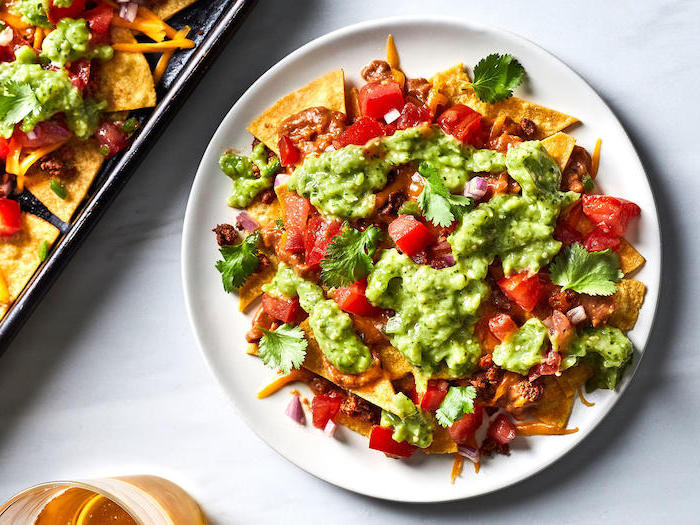 nachos in white plate, tortilla chips, with salsa and guacamole, best diet for fat loss, white table
