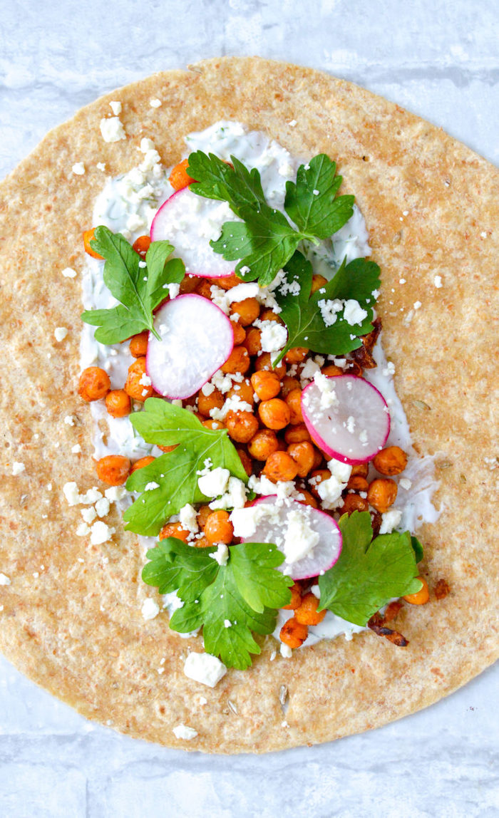 chopped turnip, yoghurt sauce, chickpea wrap, healthy meal prep, parsley garnish, tortilla wrap