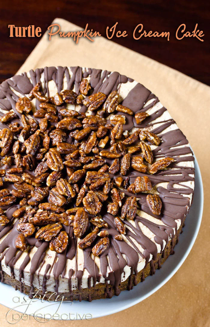 turtle pumpkin ice cream cake, chocolate and walnuts on top, best thanksgiving desserts, white cake stand