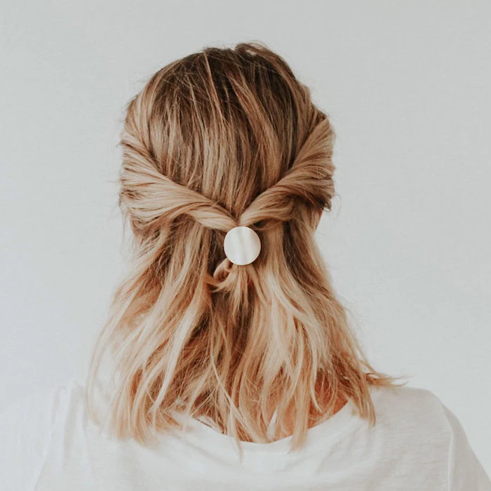 twisted half ponytail, on woman with blonde hair, wearing white blouse, shoulder length hairstyles, white background