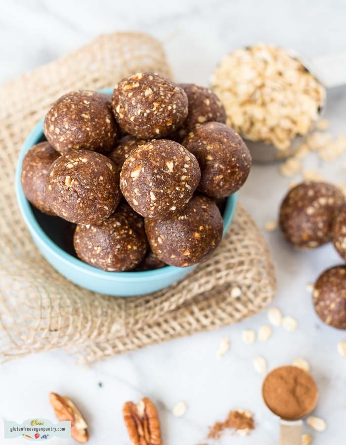 walnuts and oatmeal, scattered on a marble countertop, healthy energy balls, in a blue bowl