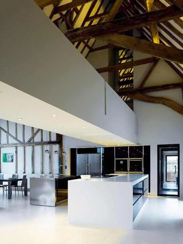 white kitchen island, vaulted vs cathedral ceiling, wooden beams, white bridge, white tiled floor