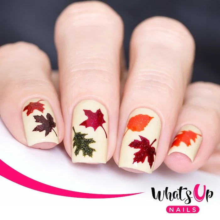 white nail polish, popular nail colors, orange and red, green and purple, glitter fall leaves, short nails