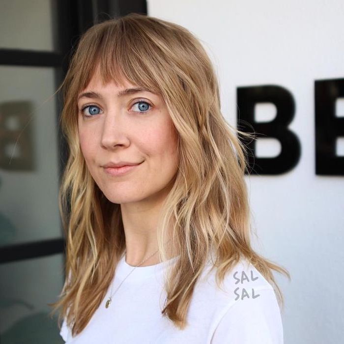 woman wearing white t shirt, medium hairstyles 2019, blonde wavy hair with bangs, white background