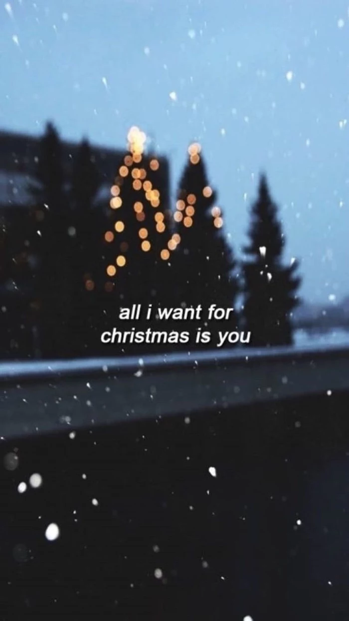 all i want for christmas is you, free desktop wallpaper, trees in the background, decorated with lights, snow falling