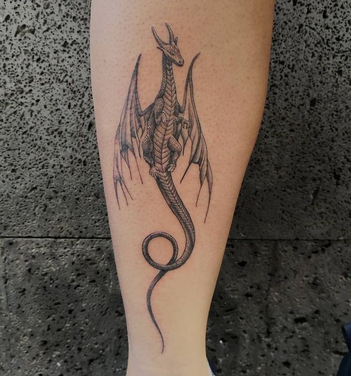 flying dragon, back of leg tattoo, dragon tattoo, grey background