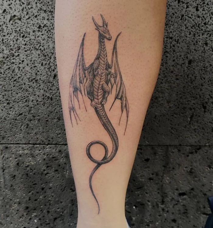 flying dragon, back of leg tattoo, dragon tattoo, grey background