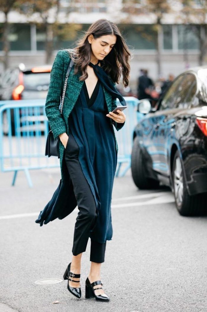 woman walking down the street, 2019 fashion trends, looking at her phone, wearing turquoise blazer and long dress