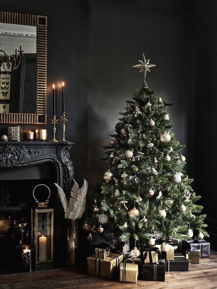 green faux tree decorated with gold and silver ornaments, presents underneath wrapped in gold and black paper, how to decorate a christmas tree