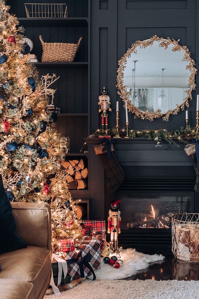 decorated tree with lots of lights, blue ribbon and red and gold ornaments, how to decorate a christmas tree, wrapped presents underneath