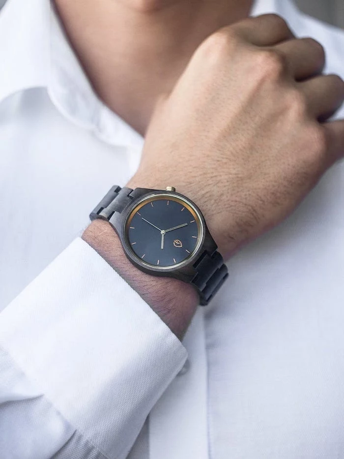 man wearing a white shirt, watch with black straps on the wrist, gift ideas for men