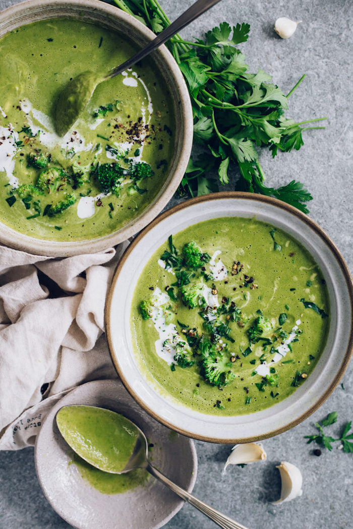 cream of mushroom soup recipe, broccoli soup with fresh parsley garnish, in ceramic bowls, on granite countertop